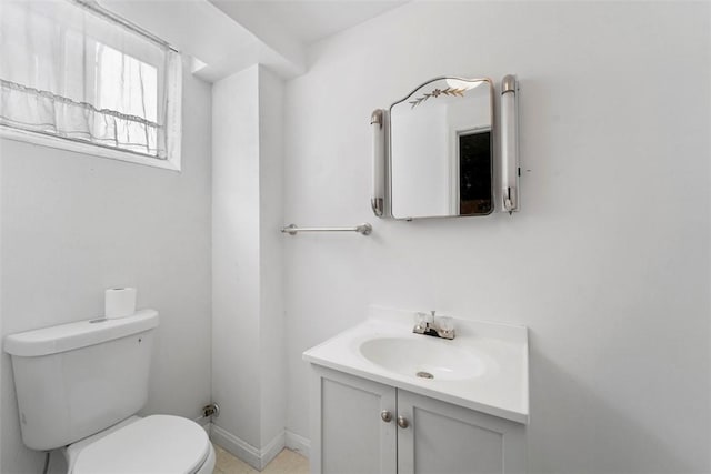 bathroom featuring toilet and vanity