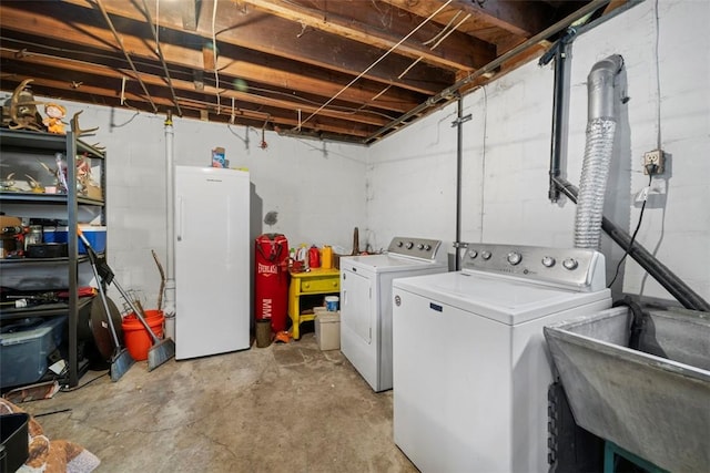 laundry room featuring sink and independent washer and dryer