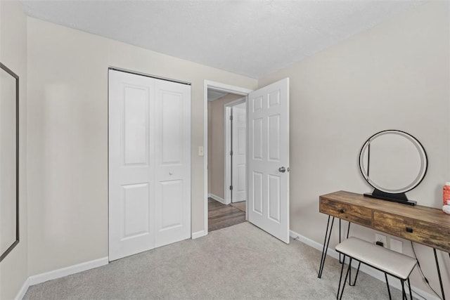 carpeted bedroom with a closet