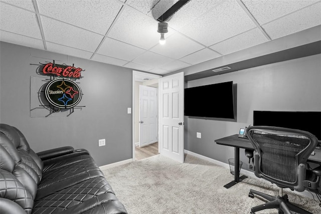 office space with light colored carpet and a drop ceiling