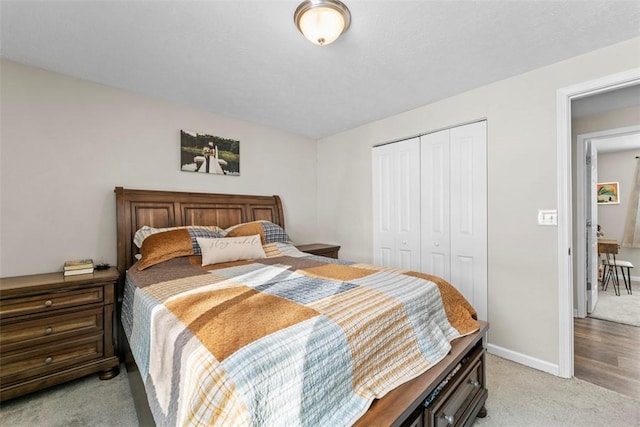 carpeted bedroom featuring a closet