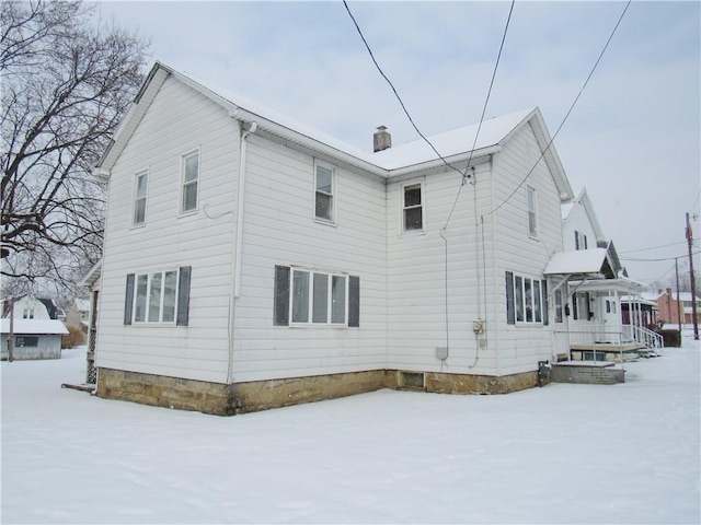 view of snow covered property