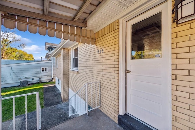 doorway to property featuring central AC unit