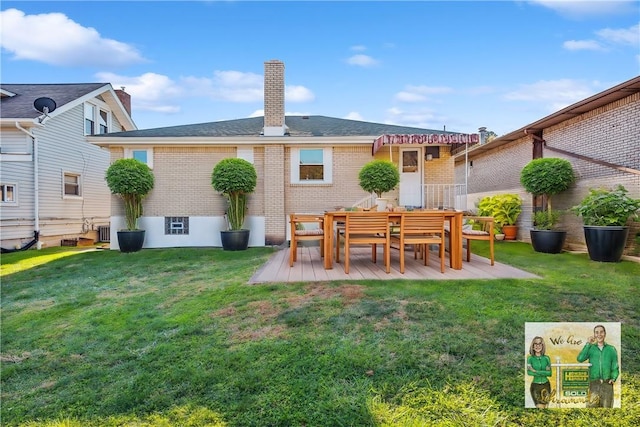 rear view of house featuring a lawn and a patio area