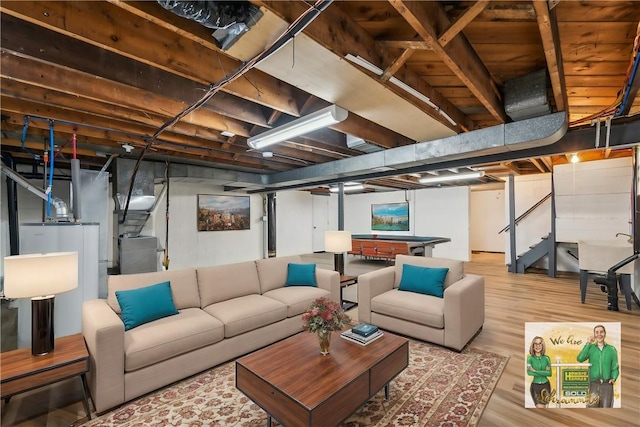 basement with hardwood / wood-style flooring