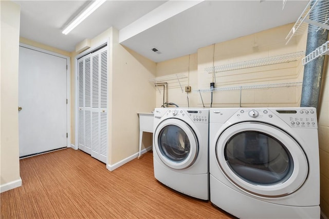 laundry area featuring separate washer and dryer