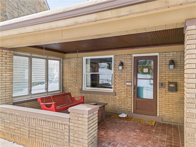 property entrance featuring covered porch