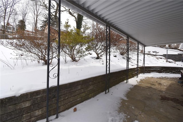 view of yard layered in snow