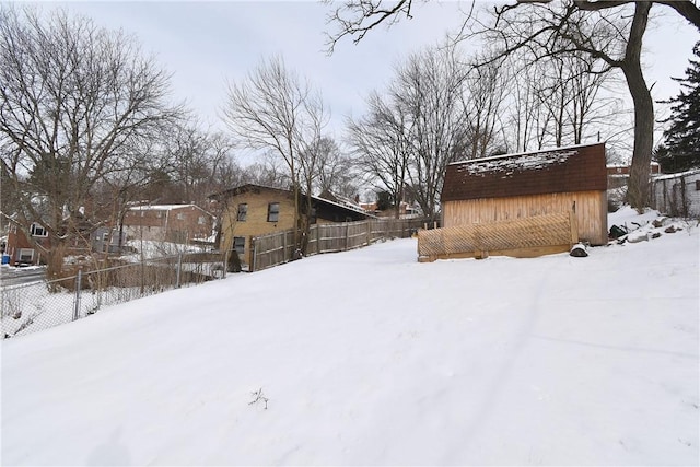 view of yard layered in snow