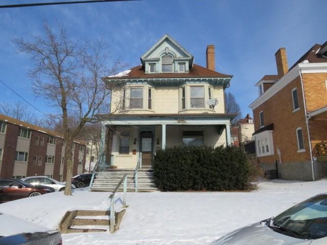 view of front of property featuring covered porch