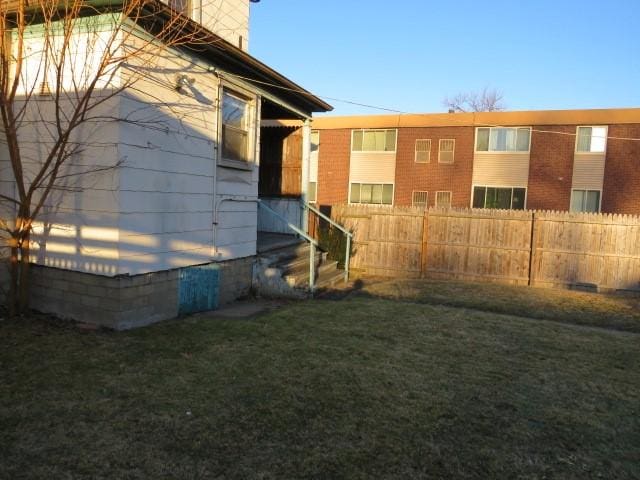 exterior space featuring a yard and fence