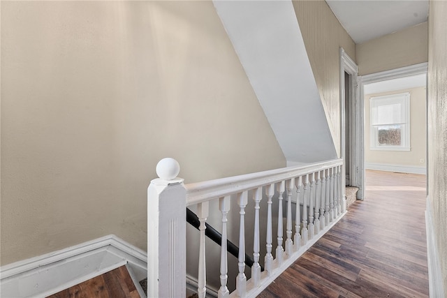 stairway featuring wood-type flooring