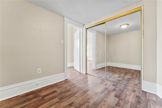 interior space with hardwood / wood-style floors and a closet