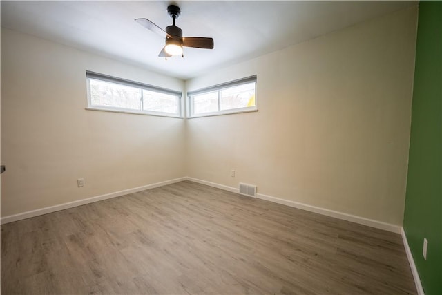 unfurnished room featuring ceiling fan and wood-type flooring