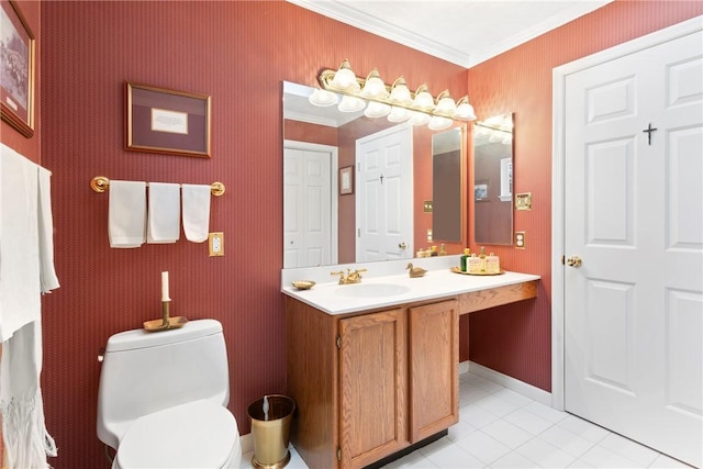 bathroom with toilet, vanity, ornamental molding, and tile patterned flooring