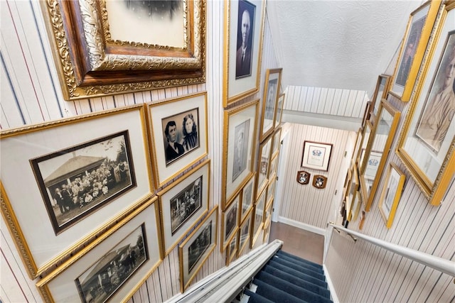 stairway with hardwood / wood-style floors