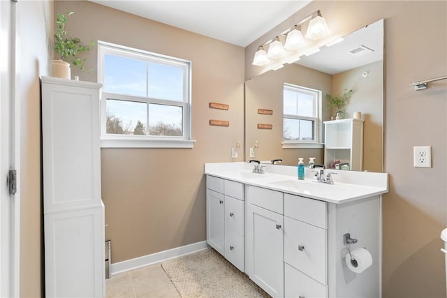 bathroom with tile patterned floors and vanity