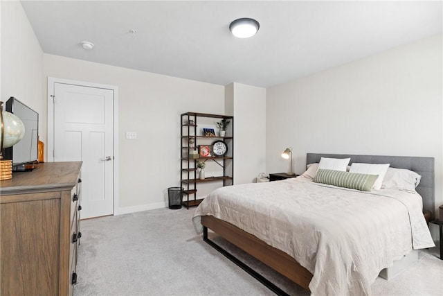 bedroom with light carpet