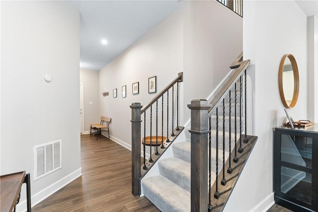 stairs with wood-type flooring