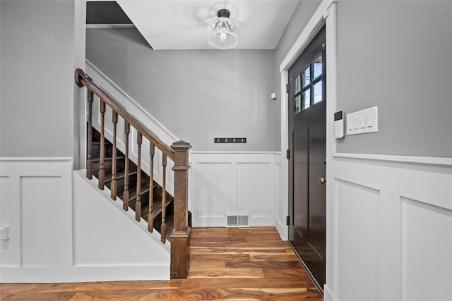 foyer with wood-type flooring