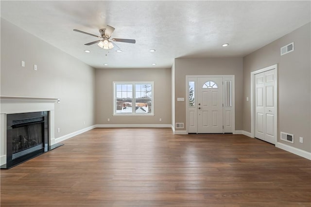 foyer with dark wood-type flooring and ceiling fan