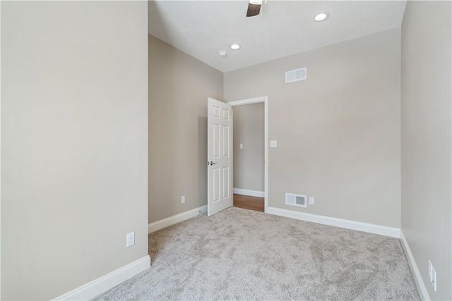 carpeted empty room with ceiling fan