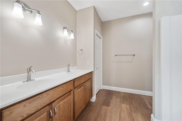 bathroom featuring vanity and wood-type flooring