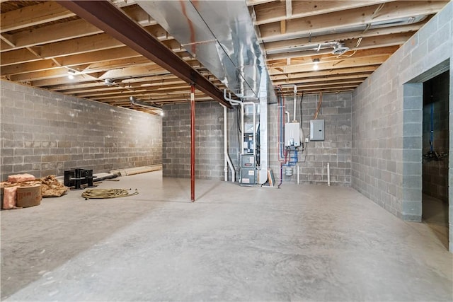 basement with electric panel and tankless water heater