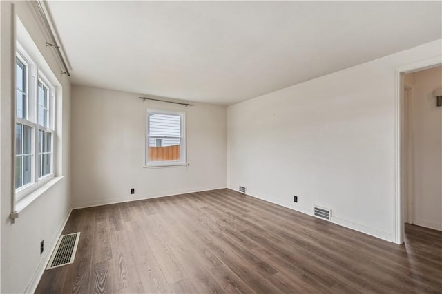 empty room with wood-type flooring