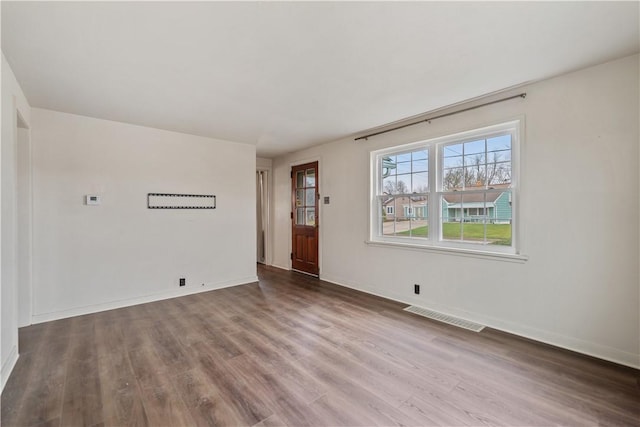 empty room featuring wood-type flooring