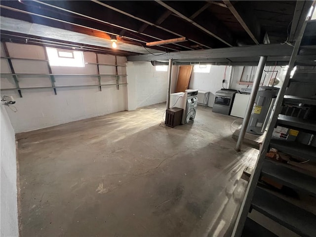 basement featuring washer / dryer and water heater