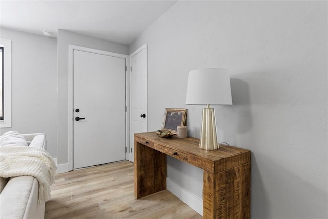 foyer entrance with light hardwood / wood-style flooring