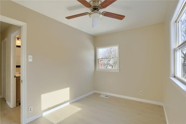 unfurnished room featuring ceiling fan and light hardwood / wood-style flooring