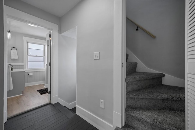 stairway featuring hardwood / wood-style flooring