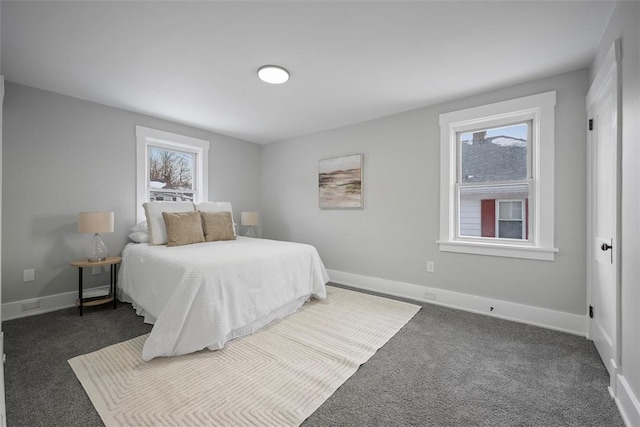 bedroom featuring dark carpet