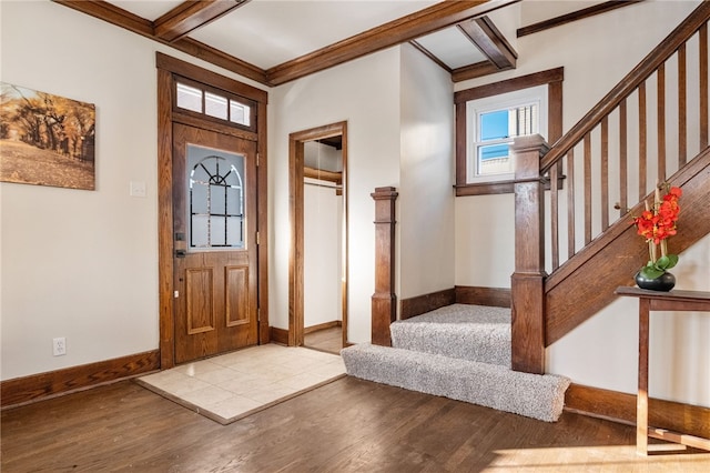 foyer entrance featuring light hardwood / wood-style flooring and crown molding