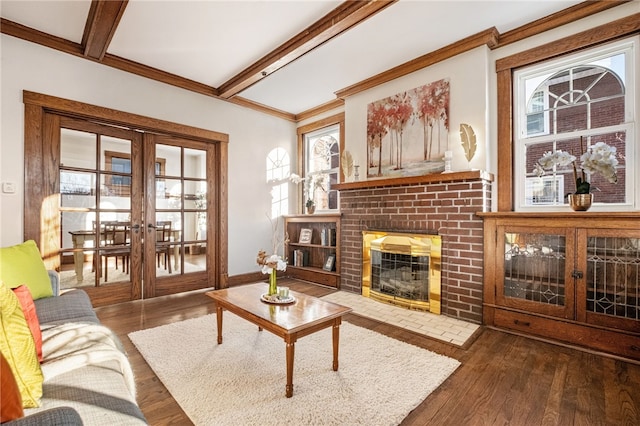 living room featuring french doors, beam ceiling, a fireplace, and dark hardwood / wood-style flooring