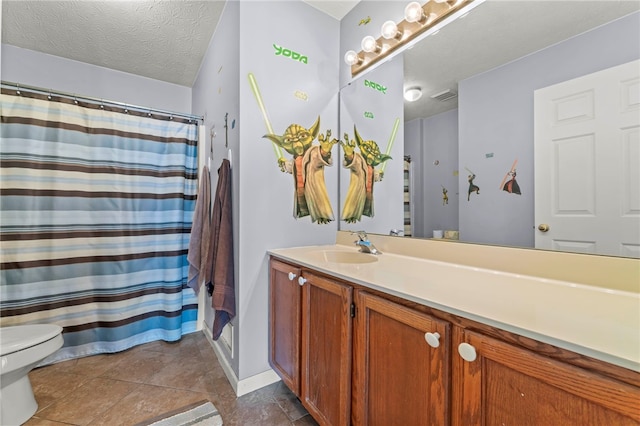 bathroom featuring a shower with curtain, toilet, a textured ceiling, and vanity