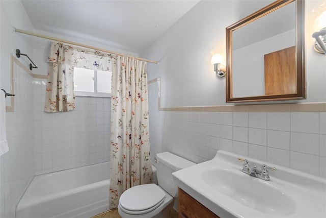 full bathroom featuring tile walls, toilet, vanity, and shower / tub combo with curtain