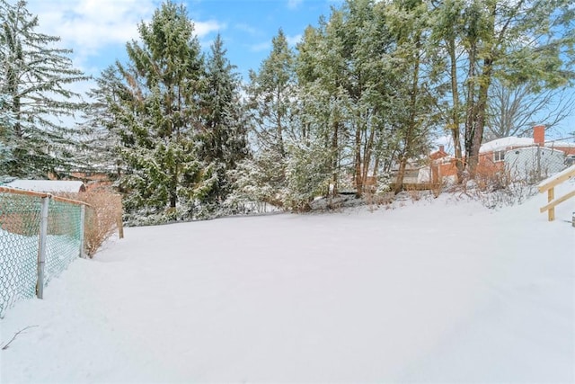 view of yard covered in snow