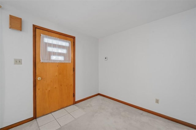 entrance foyer with light carpet