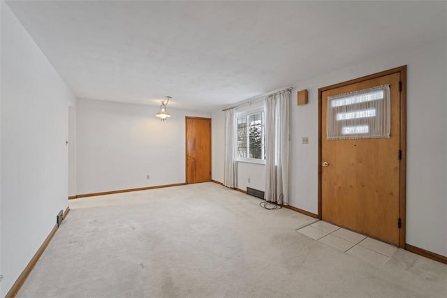 entrance foyer with light carpet