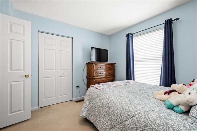 carpeted bedroom featuring a closet