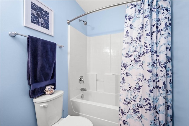 bathroom featuring toilet and shower / tub combo with curtain