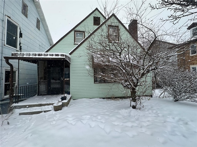 view of snow covered house