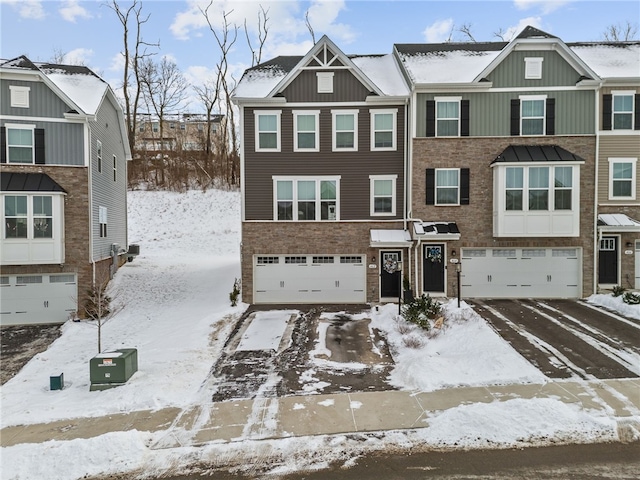 multi unit property featuring a garage