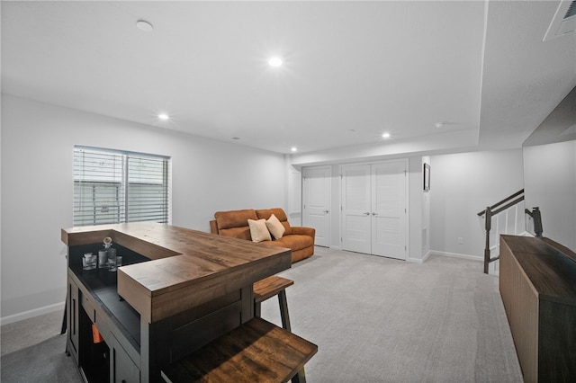 dining room with light colored carpet