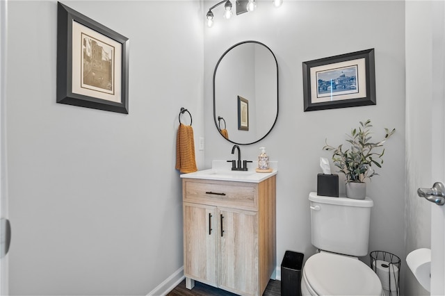 bathroom with toilet and vanity