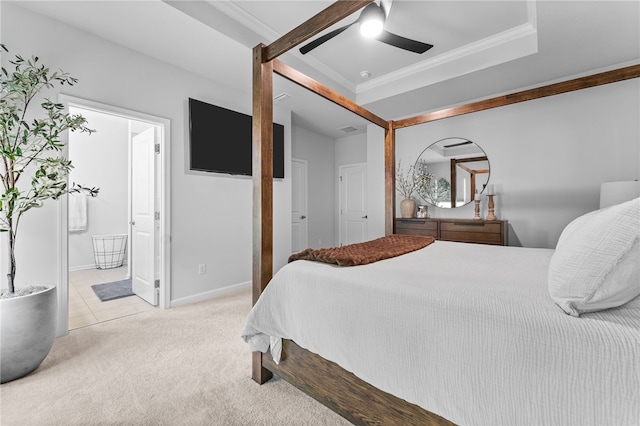 carpeted bedroom with ceiling fan, ornamental molding, and ensuite bath