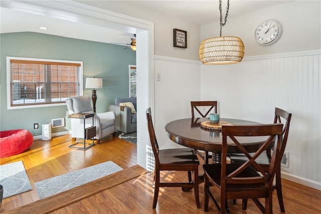 dining area with light hardwood / wood-style floors and ceiling fan